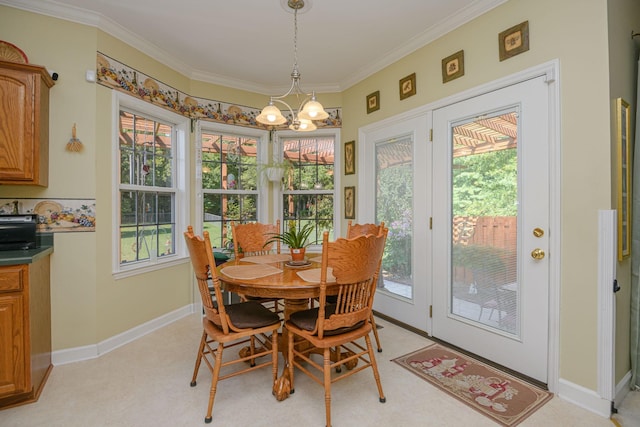 dining area featuring ornamental molding and a notable chandelier