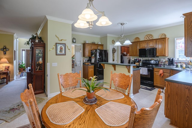 dining area with crown molding, sink, and light colored carpet