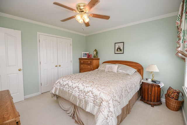 bedroom with light carpet, crown molding, and a closet