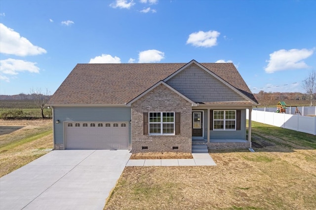 view of front facade featuring a porch, a garage, and a front lawn