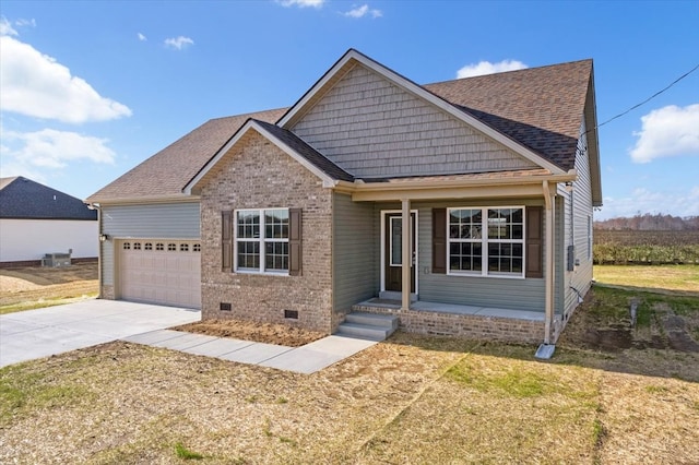 view of front of property with a front yard and a garage