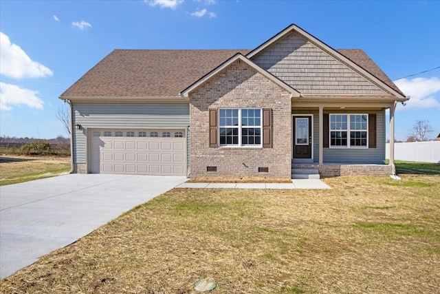 view of front of property with a garage and a front lawn