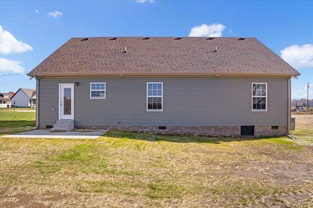 back of house featuring a yard