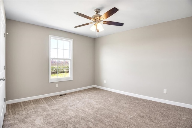 carpeted empty room with ceiling fan