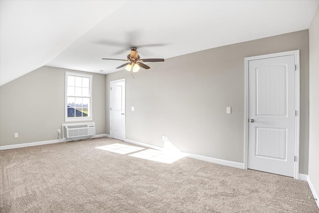 bonus room featuring lofted ceiling, ceiling fan, an AC wall unit, and carpet floors