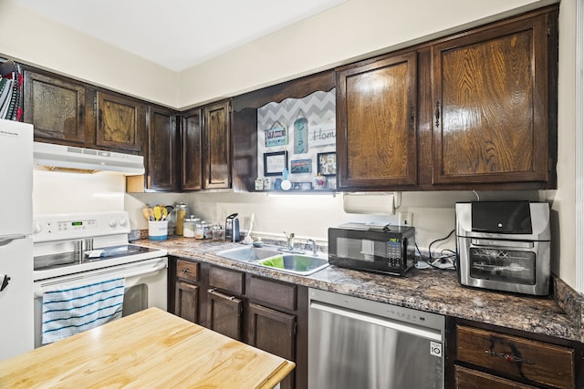 kitchen featuring dark brown cabinetry, white appliances, and sink