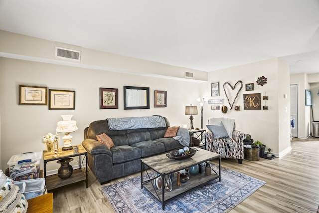 living room with light hardwood / wood-style floors