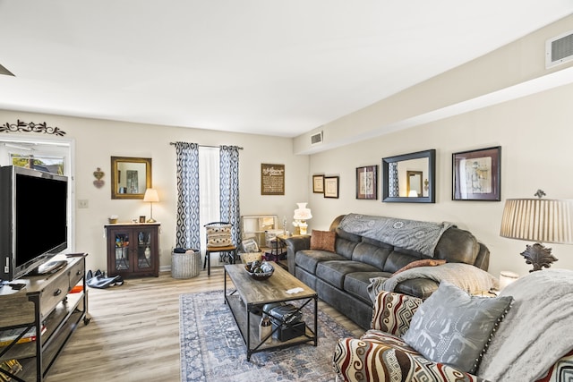 living room with light hardwood / wood-style floors