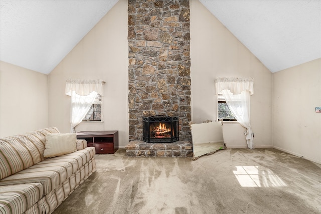 carpeted living room featuring a stone fireplace and high vaulted ceiling