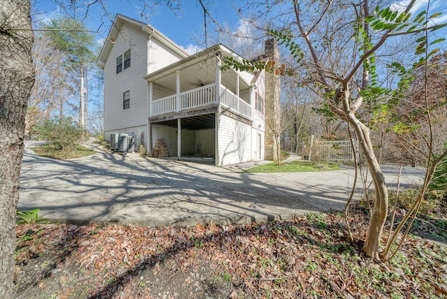 rear view of property featuring a balcony