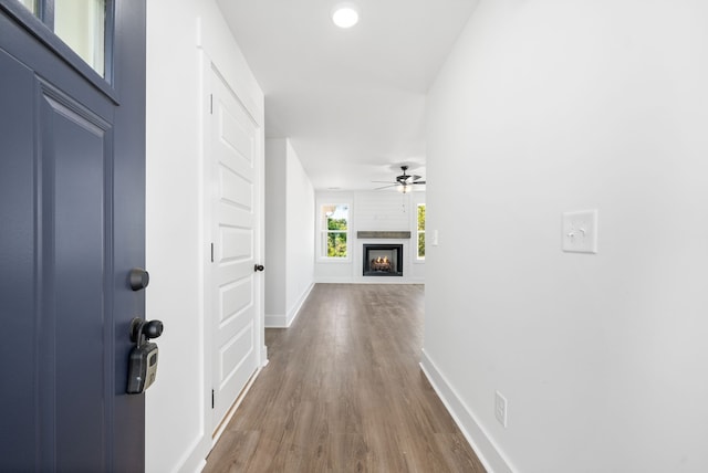 corridor with wood-type flooring