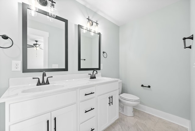 bathroom with ceiling fan, vanity, and toilet