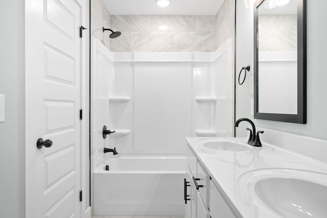 bathroom featuring shower / bathing tub combination and vanity