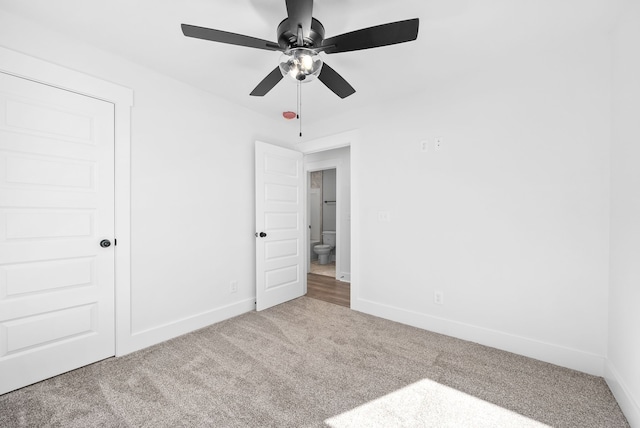 unfurnished bedroom featuring ceiling fan, a closet, and carpet