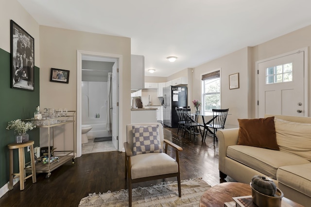 living room featuring sink and hardwood / wood-style floors