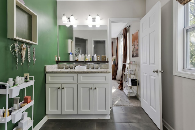 bathroom featuring tile patterned floors, vanity, and a wealth of natural light