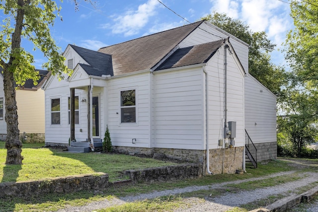 bungalow with a front yard