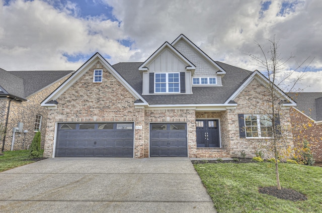 craftsman-style house with a front yard and a garage