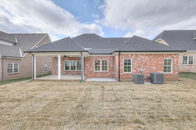 back of house with a patio, central AC, and a lawn