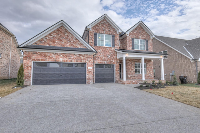 view of front of property with a garage and a porch