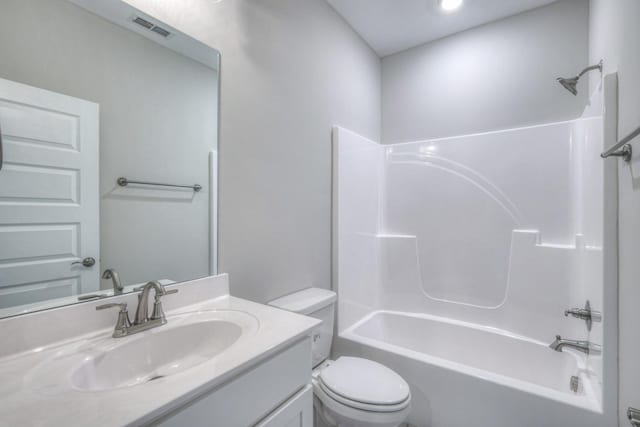 full bathroom featuring shower / tub combination, vanity, and toilet