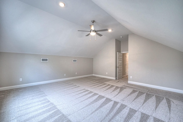 additional living space with ceiling fan, carpet flooring, and vaulted ceiling