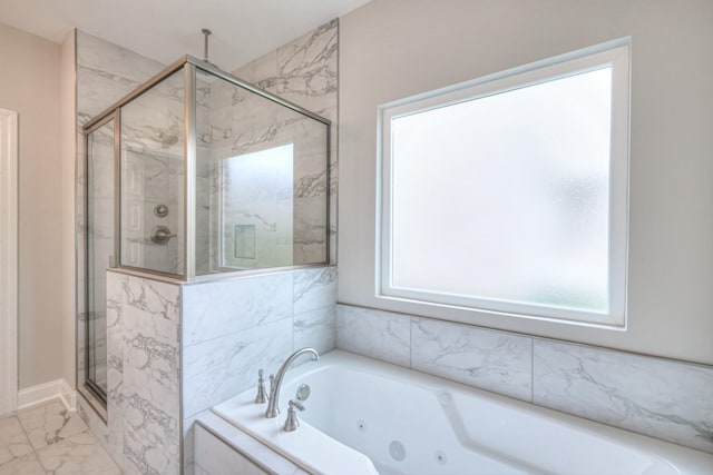 bathroom featuring shower with separate bathtub