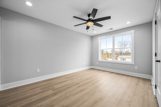 empty room with light hardwood / wood-style floors and ceiling fan