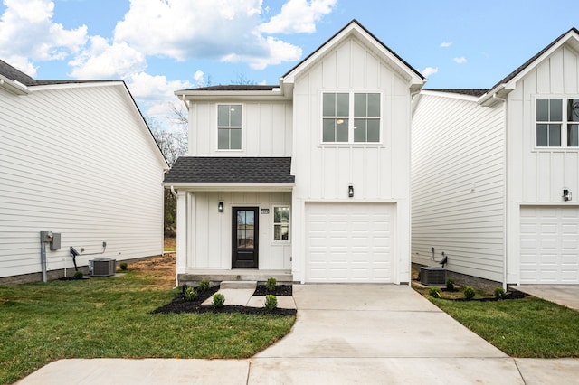 modern inspired farmhouse featuring a front yard, a garage, and central AC unit