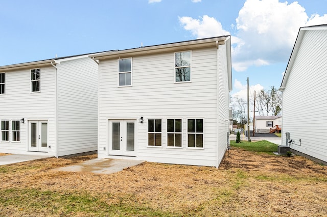 rear view of house featuring french doors and a patio area