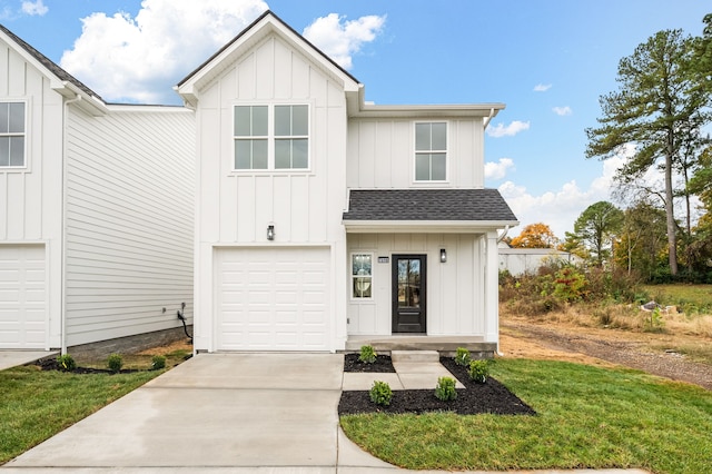 modern farmhouse style home featuring a garage and a front lawn