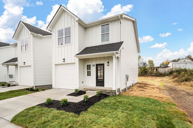 view of front of house with a garage and a front lawn