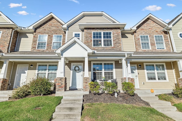 townhome / multi-family property with covered porch