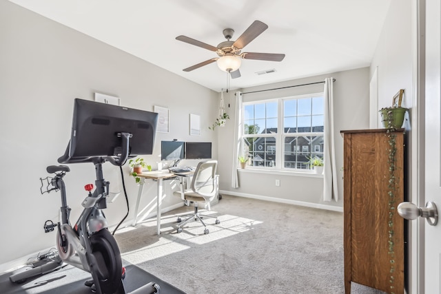 home office featuring carpet floors and ceiling fan