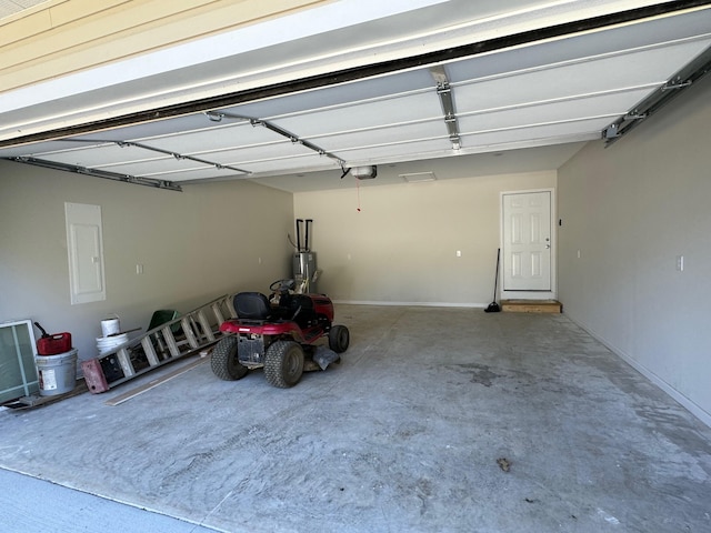 garage featuring a garage door opener and water heater