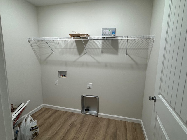 laundry room featuring wood-type flooring, electric dryer hookup, and washer hookup