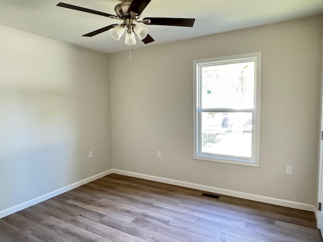 empty room featuring ceiling fan and light hardwood / wood-style flooring