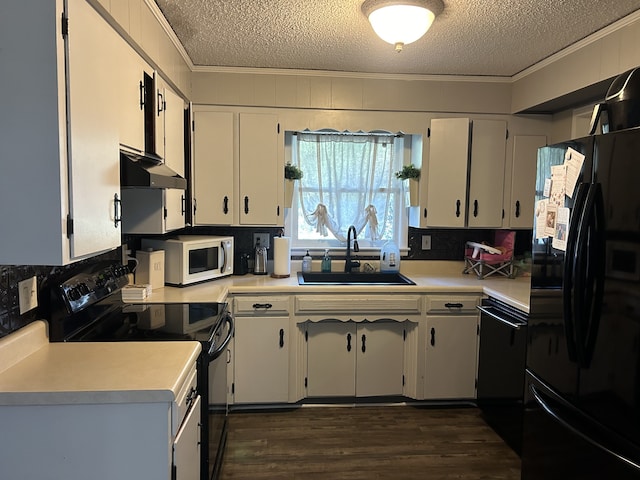 kitchen with ornamental molding, black appliances, sink, and dark hardwood / wood-style flooring