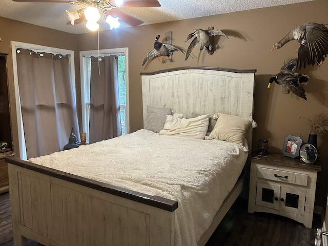 841 Asbury Dr, New Johnsonville, TN 37134 - bedroom featuring dark wood-type flooring, ceiling fan, and a textured ceiling