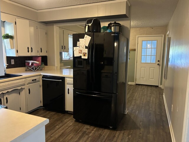 841 Asbury Dr, New Johnsonville, TN 37134 - kitchen with black appliances, dark wood-style floors, light countertops, white cabinets, and a textured ceiling