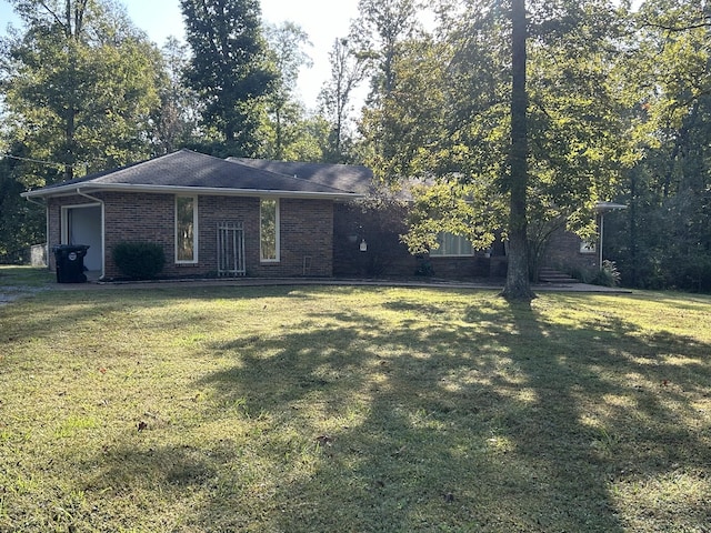 841 Asbury Dr, New Johnsonville, TN 37134 - view of front of property with brick siding and a front yard