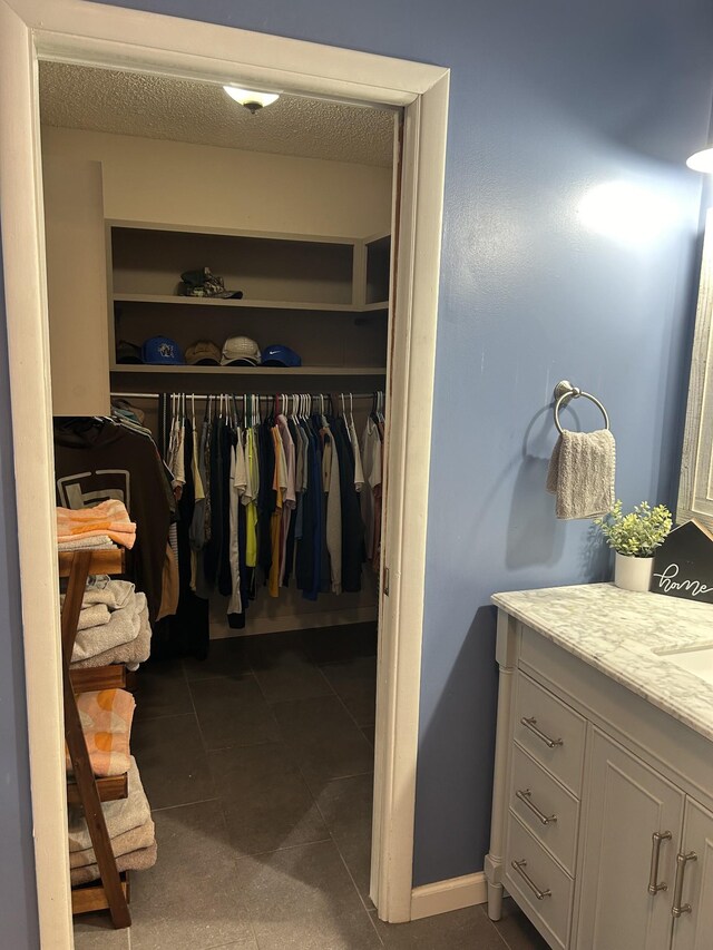 841 Asbury Dr, New Johnsonville, TN 37134 - walk in closet with tile patterned flooring