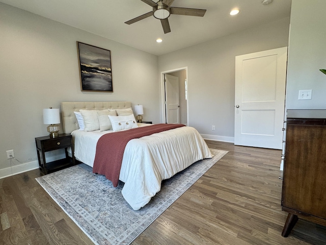 bedroom with ceiling fan and dark wood-type flooring