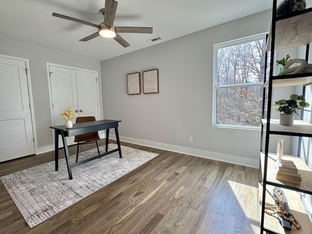 office area with dark hardwood / wood-style floors and ceiling fan