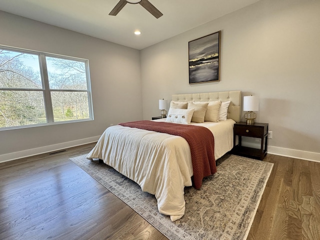 bedroom featuring ceiling fan and dark hardwood / wood-style floors