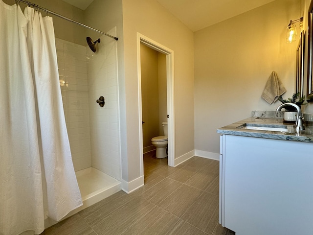 bathroom with vanity, a shower with curtain, and toilet