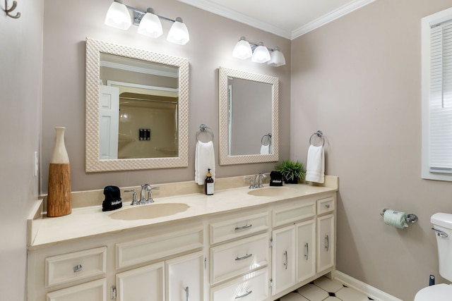 bathroom with vanity, crown molding, and toilet