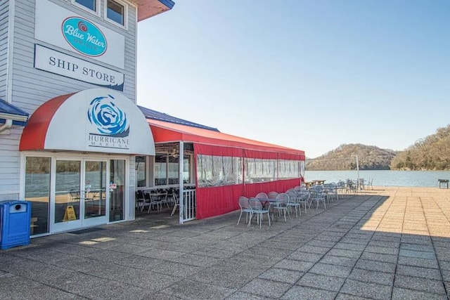 exterior space featuring a water and mountain view