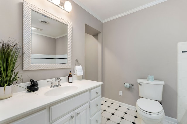 bathroom with ornamental molding, vanity, and toilet