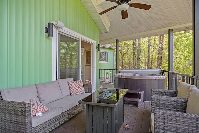 sunroom / solarium featuring ceiling fan, vaulted ceiling, and a healthy amount of sunlight